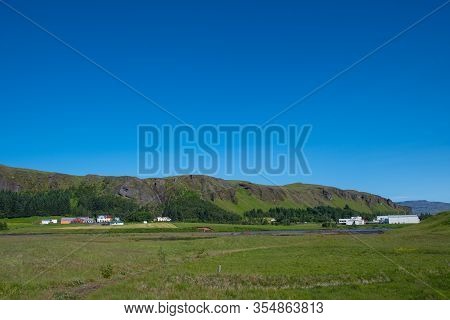 Village Of Kirkjubaejarklaustur In South Iceland On A Sunny Summer Day