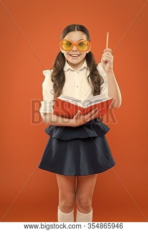 Happy Little Schoolgirl Ready For Lesson. Cute Child With Book. Only Wisdom Knowing You Know Nothing