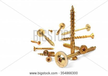 Gold Torx Screw Isolated On White. Yellow Zinc Chipboard Screw Torx, , Full Thread Close Up