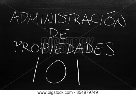 The Words Administración De Propiedades 101 On A Blackboard In Chalk.  Translation: Property Mangeme