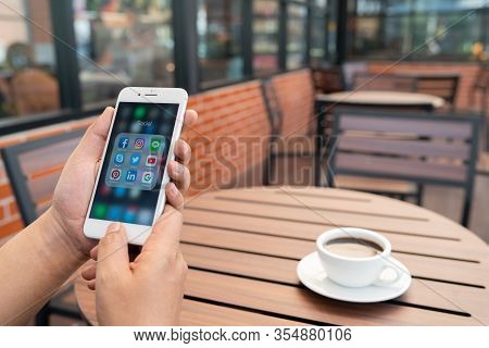 Chiang Mai, Thailand - Feb.17,2020: Man Holding Apple Iphone 8plus With Icons Of Social Media On Scr