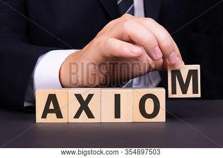 Man Made Word Axiom With Wood Blocks
