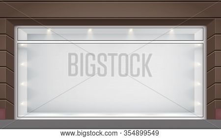 Exterior Of Shop Facade With Big Glass Storefront And Spotlights. Facade Of Granite Wall And Big Win