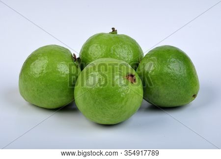 Group Of Red Guava Fruit In White Background