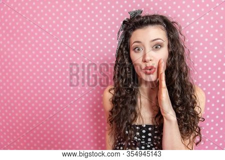 Closeup Portrait Of Beautiful Young Kinky Woman In Pin-up Style, Wispering Some Secret To The Camera