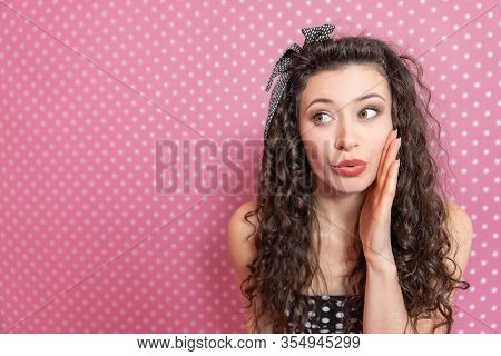 Closeup Portrait Of Beautiful Young Kinky Woman In Pin-up Style, Wispering Some Secret To The Camera