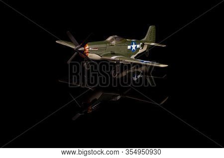 Wwii Die Cast Model Plane Isolated On The Black Background