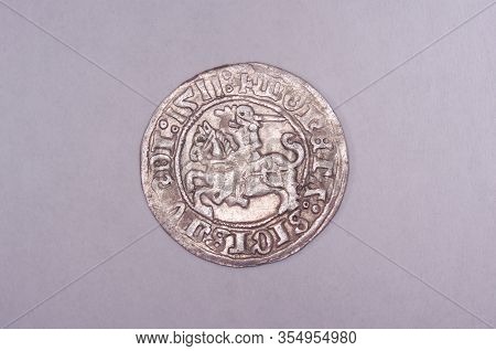 Ancient Grand Duchy Of Lithuania Coin Half-grosz Isolated On The Gray Background