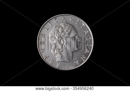 L.50 italian coin isolated on the dark background