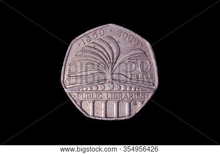 L.50 italian coin isolated on the dark background