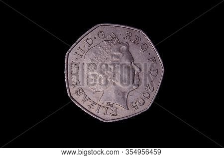 L.50 italian coin isolated on the dark background