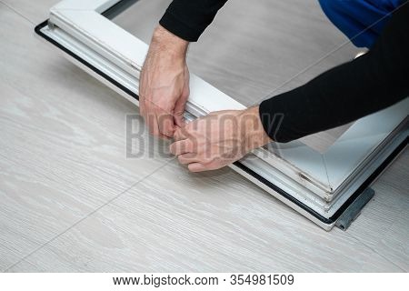 Professional Master At Repair And Installation Of Windows, Changes Rubber Seal Gasket In Pvc Windows