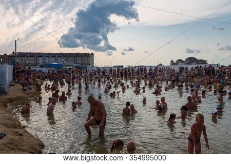 Arabat Spit, Ukraine - August 23, 2017: Unknown People Bathe In Thermal Radon Source