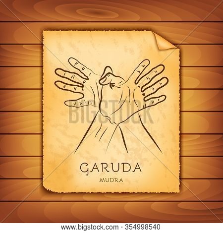 Ancient Papyrus With The Image Of Garuda-mudra On A Wooden Background. Symbol In Buddhism Or Hinduis
