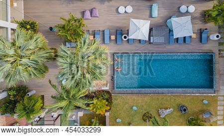 Praslin Seychelles , Couple Men And Women In Pool During Vacation At A Luxury Resort At The Beach Of