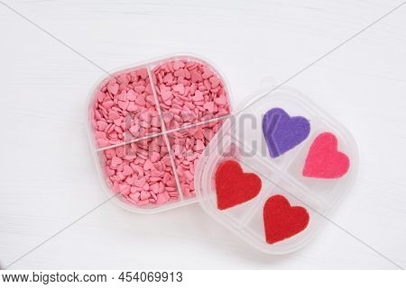 In The Pill Box, Instead Of Pills, There Are Small Pink Hearts. The Concept Of Treatment With Love A