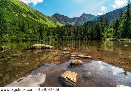 Reflection Of Peaks On Water Surface. Lake Tatliakovo Jazero In Summer Mountain Landscape In Western
