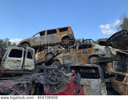 Burnt And Blown Up Car. Traces Of Shots On The Body Of The Car. Cars Damaged After Shelling. War Bet