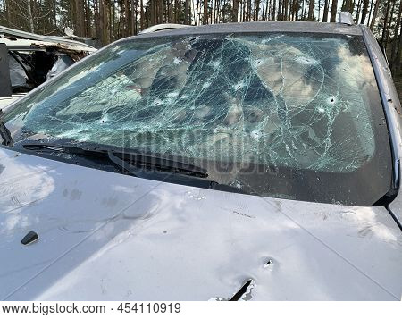 Burnt And Blown Up Car. Traces Of Shots On The Body Of The Car. Cars Damaged After Shelling. War Bet