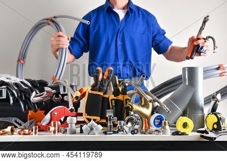 Sample Of Plumbing Materials And Tools On Workbench And White Isolated Background. Front View. Horiz