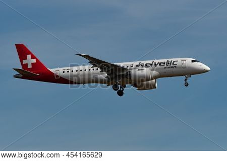 Zurich, Switzerland, February 24, 2022 Helvetic Airways Embraer E190-e2 Aircraft Final Approach On R