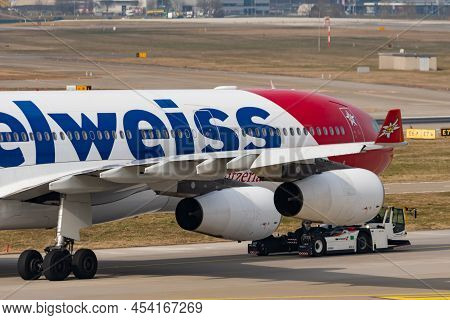 Zurich, Switzerland, March 2, 2022 A Towing Vehicle Is Taking An Edelweiss Air Airbus A340-313 Aircr