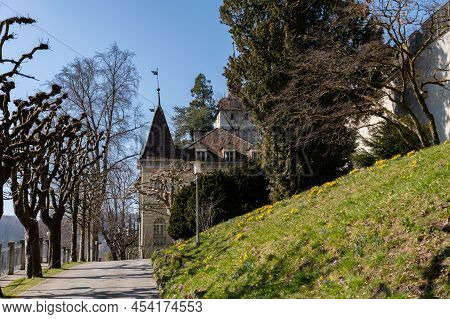 Lucerne, Switzerland, March 10, 2022 Lovely Green Park At The Musegg Walls On A Sunny Day