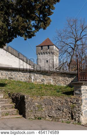 Lucerne, Switzerland, March 10, 2022 Historic Old Tower In A Pretty Park At The Musegg Walls On A Su