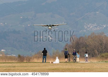 Wangen-lachen, Switzerland, March 27, 2022 Cessna 172 Propeller Plane Is Arriving On A Small Airfiel