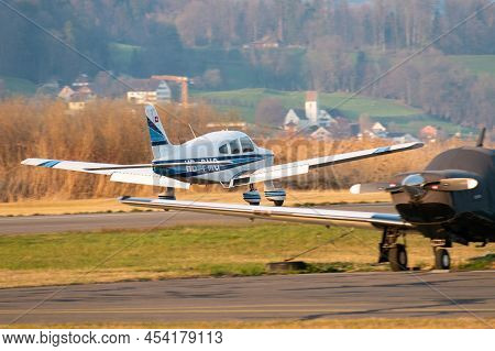 Wangen-lachen, Switzerland, March 27, 2022 Piper Pa28-181 Archer Ii Propeller Plane Is Departing Fro