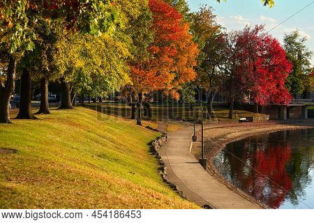 Autumn Colors At Lake Anna Park In Barberton, Ohio, On A Sunlit Evening