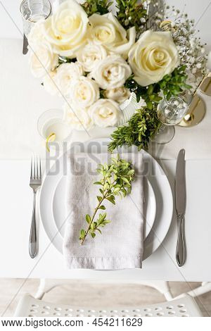 The Wedding Table Setting, Top View. Wedding Teble Decoration With White Roses And Boxwood