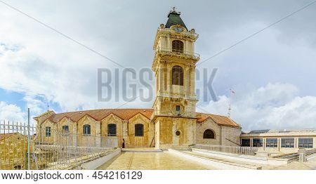 Jerusalem, Israel - November 20, 2021: View Of The Roof And Bell Tower, With A Monk, In The Monaster