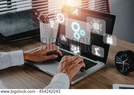 Automation Business Technology Concept, Person Hand Using Laptop Computer With Automation Technology