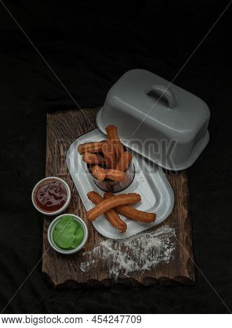 Traditional Spanish Churros Sticks (fried-dough Pastry) Served Usually With Thai Pandan Custard And 