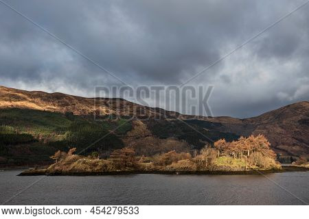 Beautiful Winter Landscape View Along Loch Leven Towards Snowcapped Mountains In Distance With Drama