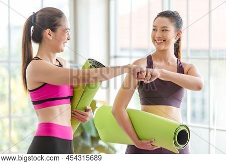 Two Asian Young Healthy Slim Beautiful Female Sporty Models In Sexy Crop Top Sportswear Standing Smi