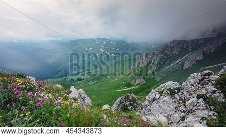 View From Above On Mountain Valley Covered With Gloomy Clouds. Lagonaki, Caucasus, Russia
