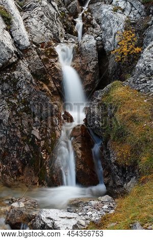Mountain River Coming Out Of A Small Gorge In Austrian Alps