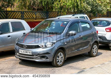 Delhi, India - February 25, 2022: Compact City Car Tata Tiago In A City Street.
