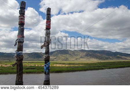 Buddhist Pillars In A Place Of Power Near The River. A Summer Day.