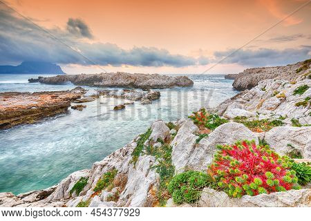 Gorgeous Evening Seascape Of Isolidda Beach On San Vito Cape. Popular Travel Destination Of Mediterr