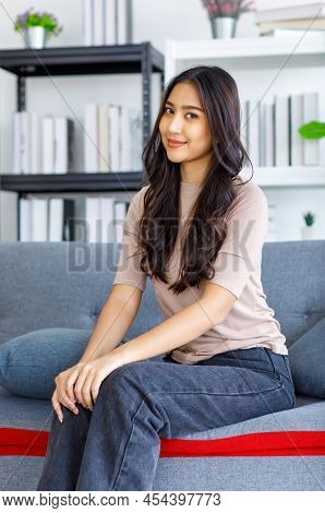 Asian Young Beautiful Happy Female Model In Casual Outfit Sitting Smiling Relaxing On Comfortable So