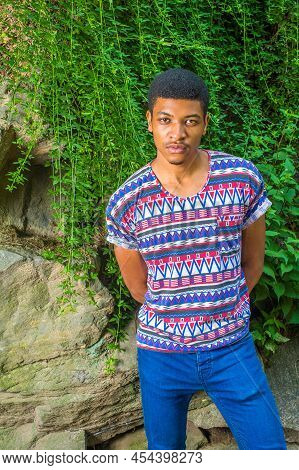 African American Man Casual Fashion In New York. Wearing Colorful Patterned, Short Sleeves, Collarle