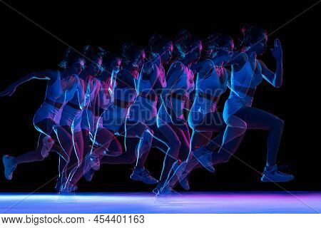 Development Of Movements. Professional Female Athlete, Runner Training Isolated On Dark Background W