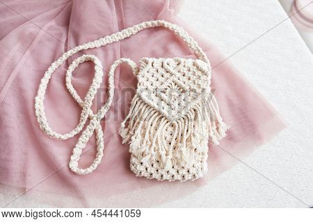 Handmade Macrame Bag  On Pink Background. Eco Friendly Natural Macrame Cotton Bag For Woman. Hobby K