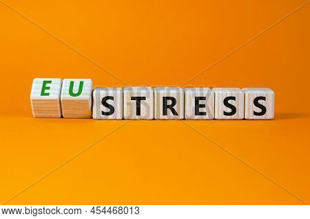 Eustress Or Stress Symbol. Turned Wooden Cubes And Changed The Concept Word Eustress To Stress. Beau