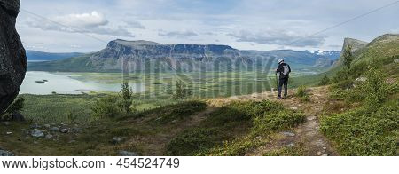 Panoramic Scenic View Of Glacial Rapadalen River Delta Valley With Lonely Hiker Figure, Skierffe Roc