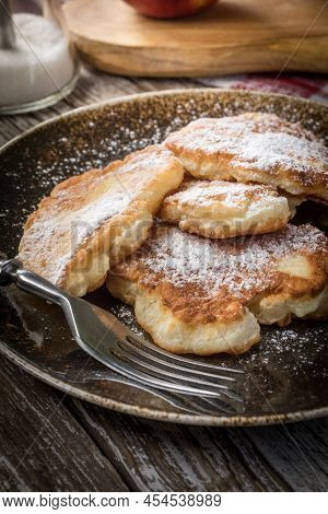 Sweet Pancakes Made Of Apple, Milk And Flour.