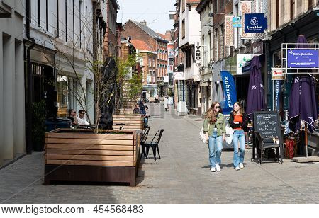 Diest, Limburg, Belgium - 11 04 2022 - Teenage Girls Walking In The Shopping Street Of Old Town